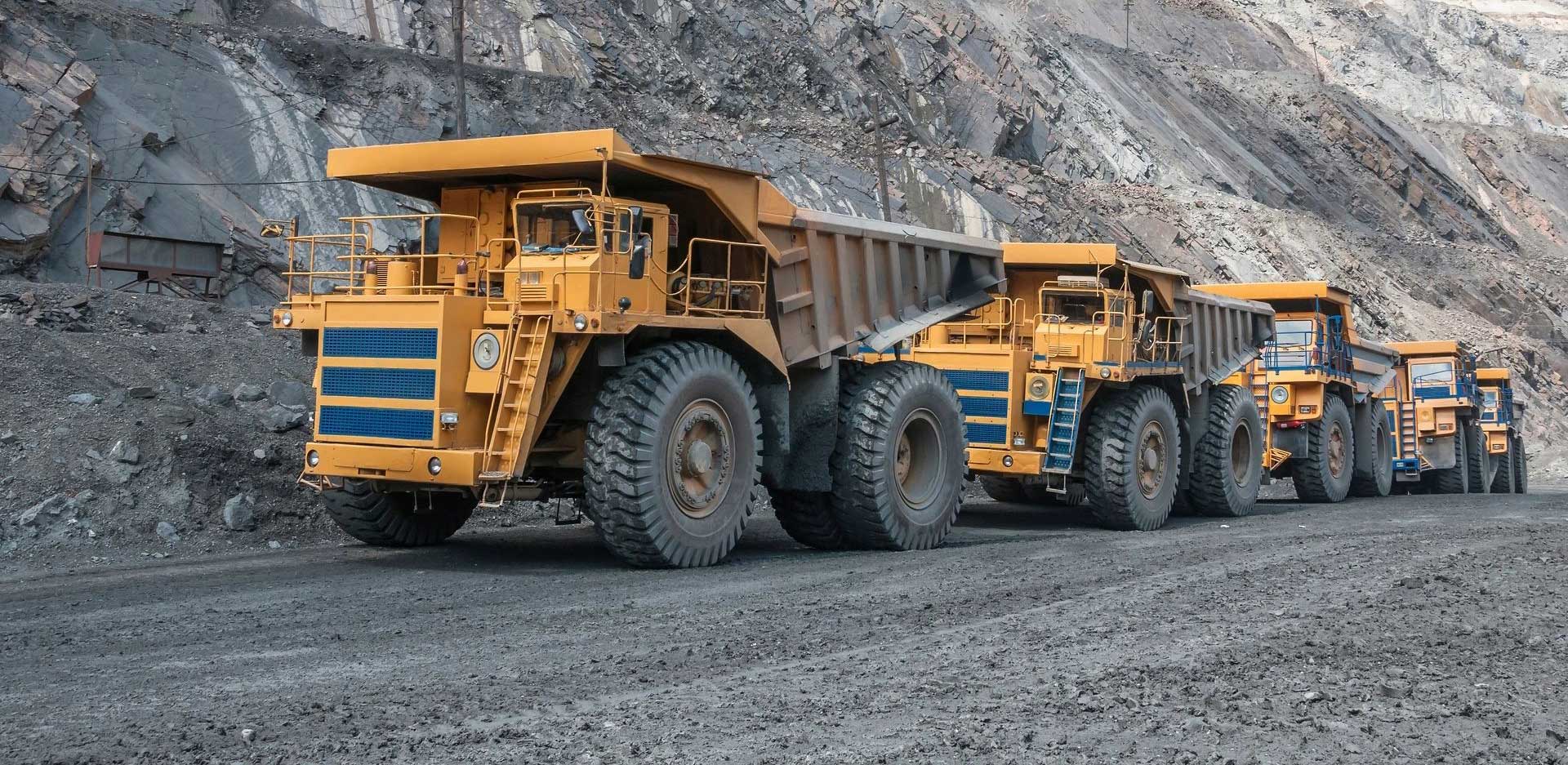 A large dump truck parked on the side of a road.