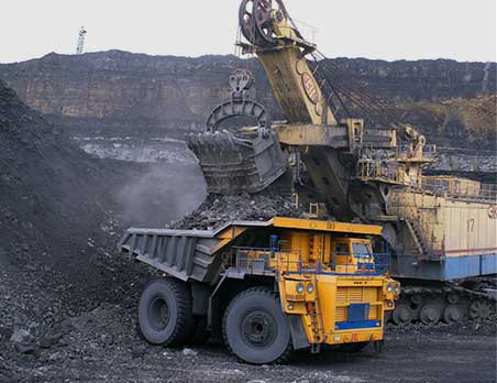 A dump truck is loaded with rocks and dirt.